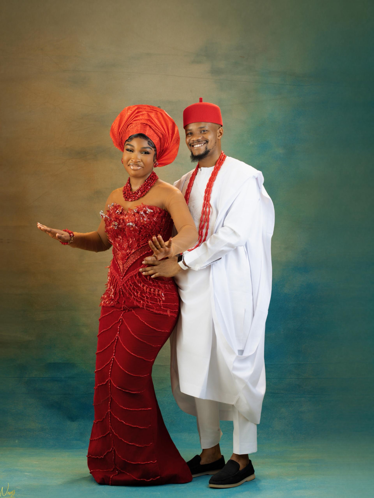 Kent and Iheoma dancing together in traditional Igbo attire